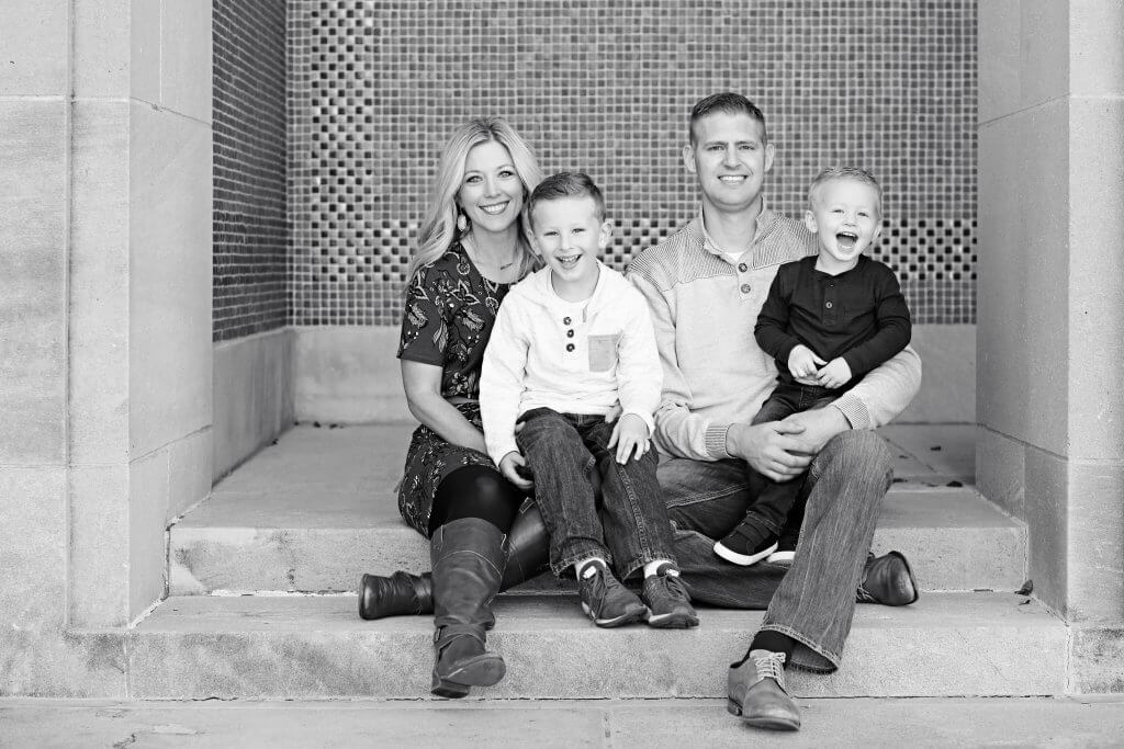 Family laughing on steps