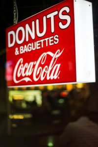 Donuts sign and diet coke sign
