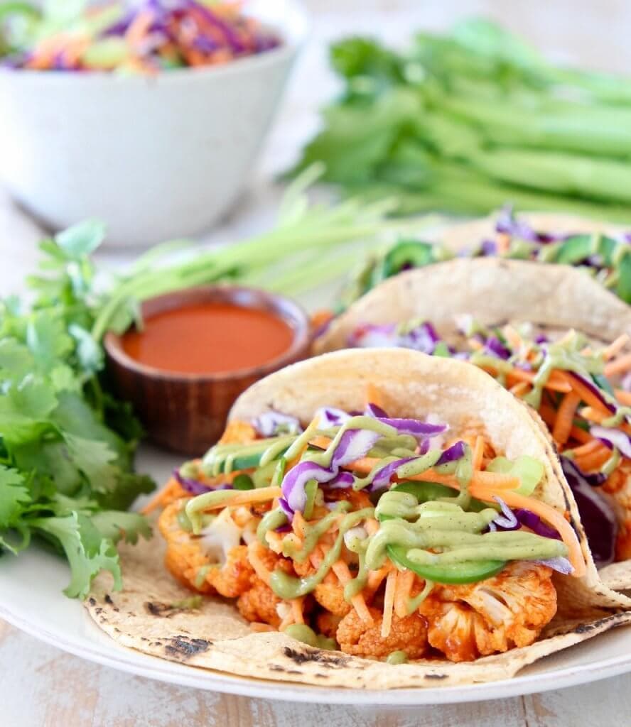 Photo of Vegan Cauliflower Tacos with lettuce and cilantro 