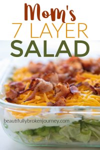A family favorite recipe! My Mom's 7 Layer Salad is perfect for a get together for a fresh and crisp side dish! #layersalad #7layersalad