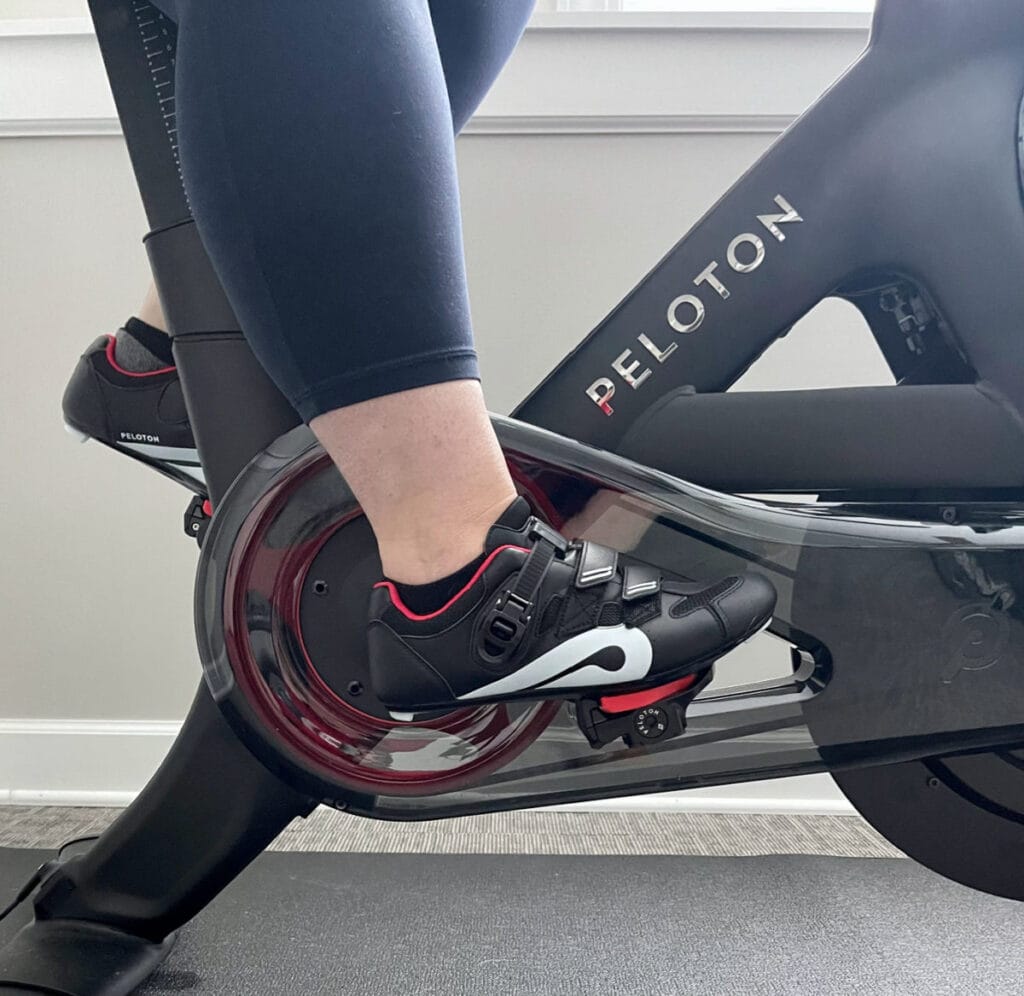 close up picture of peloton shoes clipped into a peloton bike
